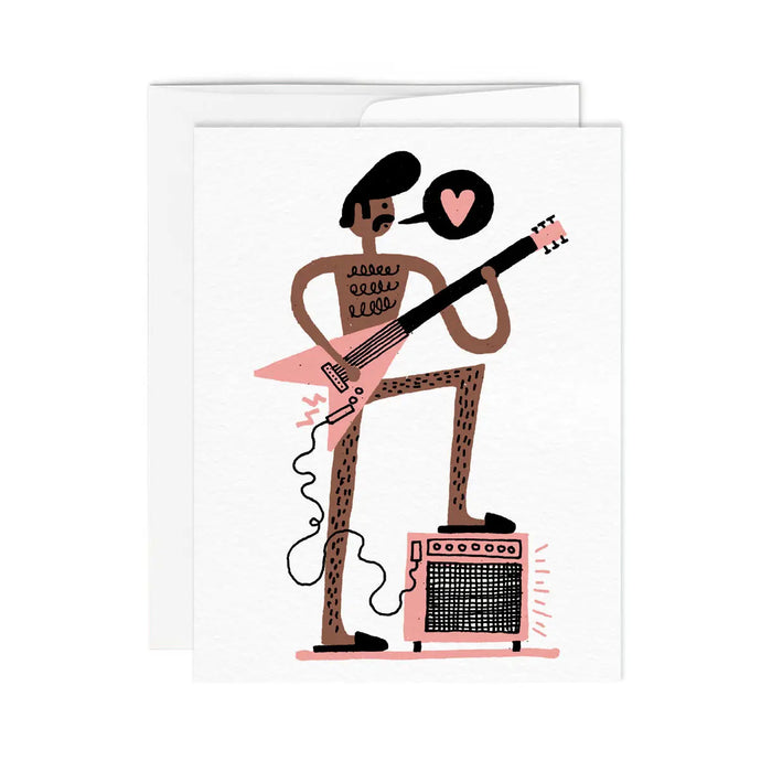 a greeting card featuring an illustration of a man with a big hair do playing a guitar and one foot on an amplifier. 