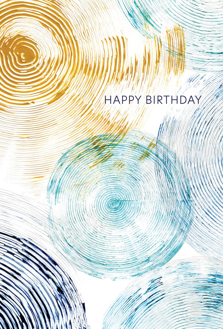 a birthday card with swirls like the inside of a log or tree . text happy birthday 