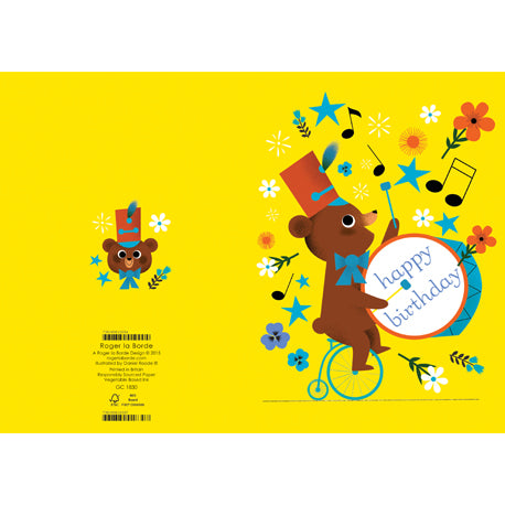 a greeting card with whimsical illustration of a teddy bear riding a three wheeled bike and playing a big base drum with musical notes all about. text happy birthday