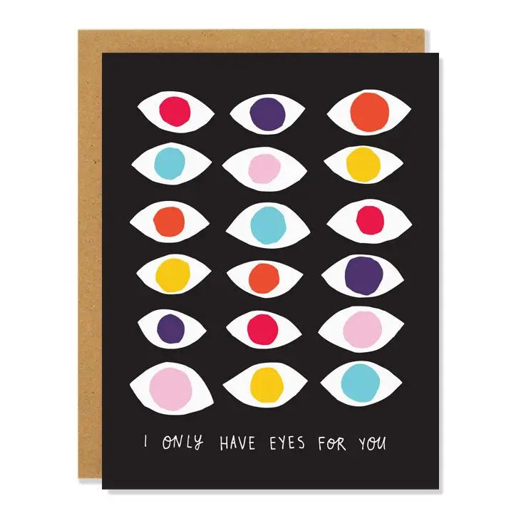 a black coloured greeting card with 12 illustrated eyes in different colours with text I only have eyes for you