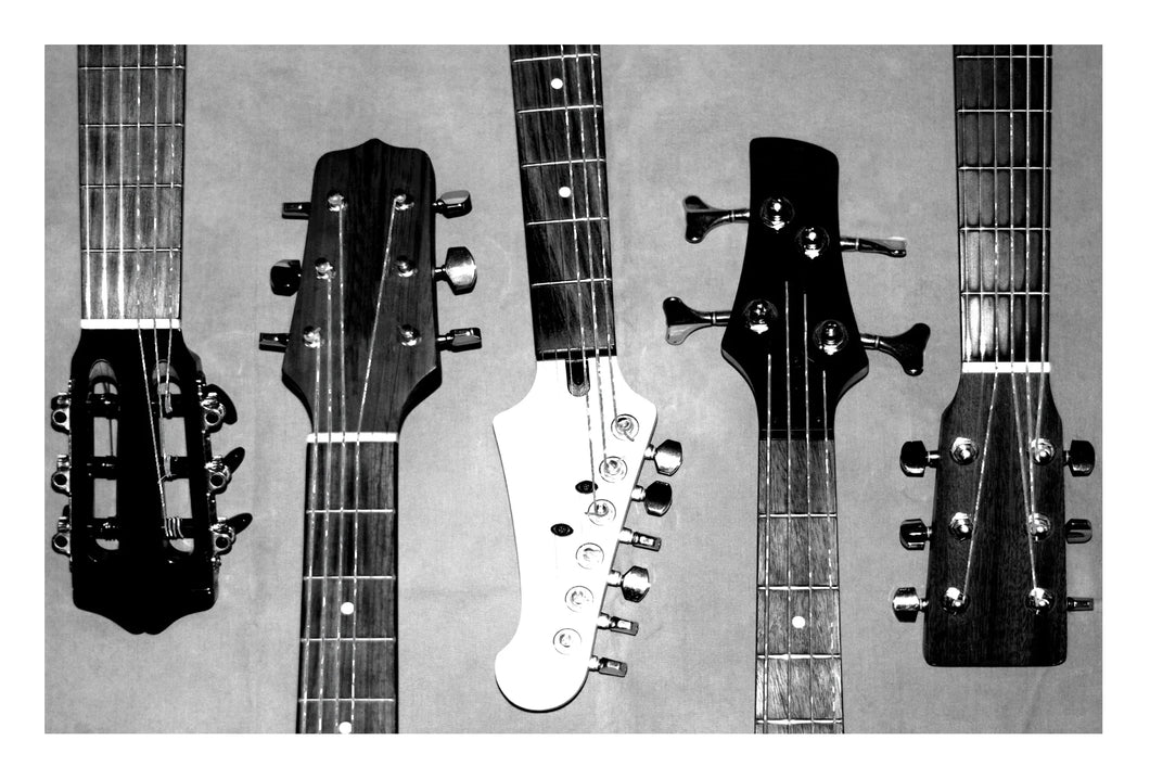 a greeting card of a black and white photo of five guitars 