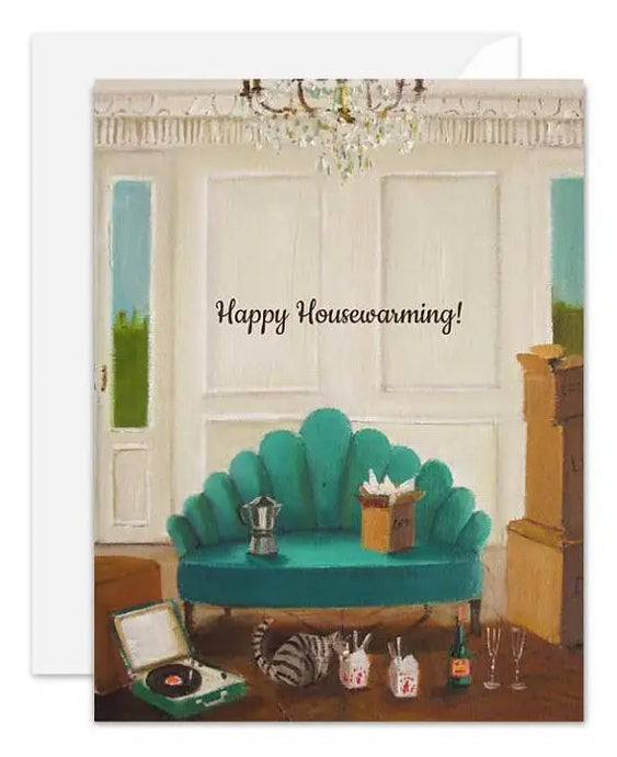 a greeting card with an illustration of a green sofa with a box opened on it , a cat eating from a take away food box on the floor and a record player in the room. text happy housewarming 