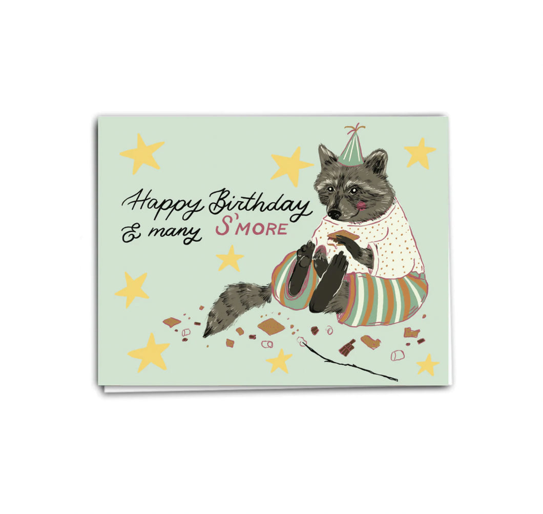 colour illustration of a racoon eating birthday cake with text happy birthday and many smore 