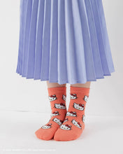 Load image into Gallery viewer, pink hello kitty motif socks on a person wearing a long skit 
