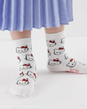 画像をギャラリービューアに読み込む, white hello kitty socks on a person wearing a long skirt

