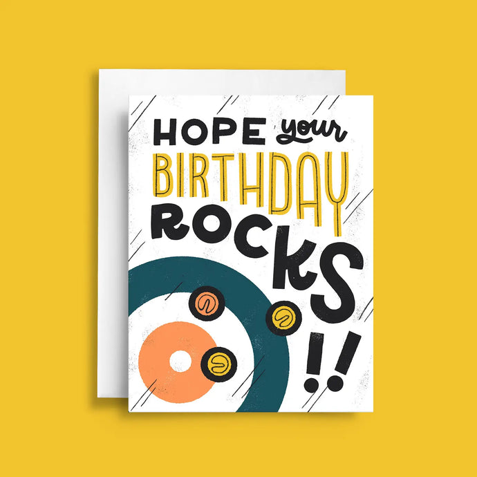 colourful illustraion of a curling sports rings on the ice with 3 curling rocks and text hope your birthday rocks. 