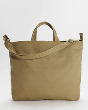 画像をギャラリービューアに読み込む, a photo of a baggu zip duck bag with handles and strap in a dark khaki colour 
