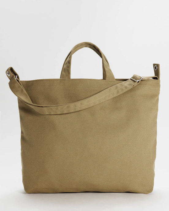 a photo of a baggu zip duck bag with handles and strap in a dark khaki colour 