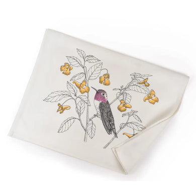 a white tea towel with an illustration of a pink throated hummingbird sitting  on a branch 