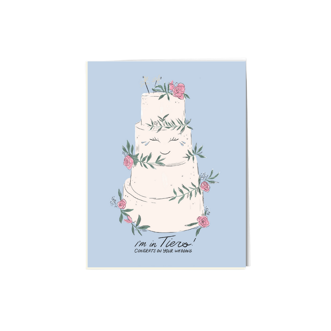 an illustration of a four tiered white wedding cake with small  pink flowers on a blue background