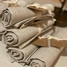 Load image into Gallery viewer, a photo of a stack of linen tea towels in a beige linen colour 
