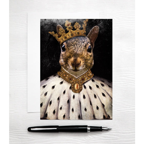 colour photo of a squirel wearing a crown and fur robes