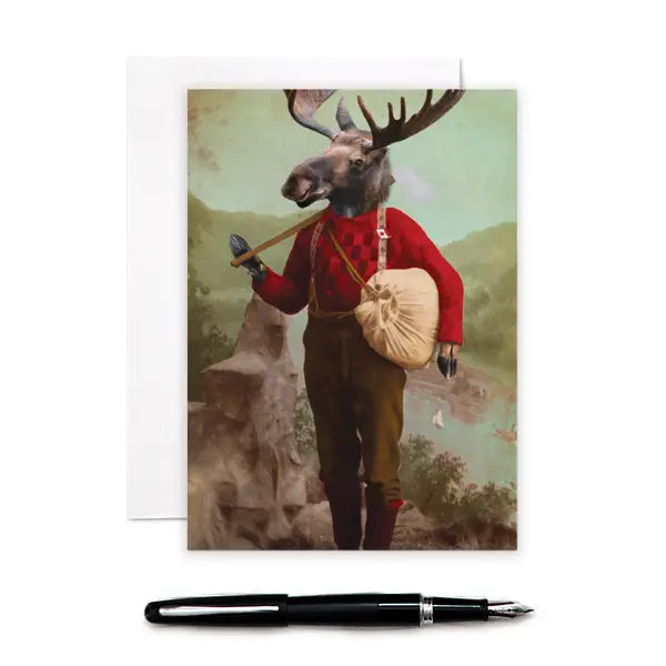 a greeting card with an image of a moose standing up on its back legs wering brown trousers and a checkered sweater holding a duffle bag . on a mountainside.