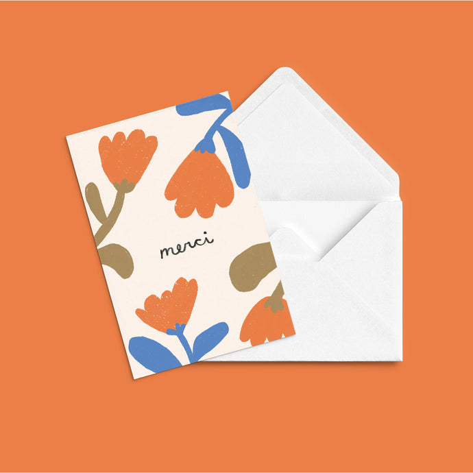 A greeting card with orange and blue painted modern flowers with text merci