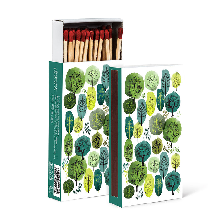a box of wooden matches with a green modern forest illustration on the box 