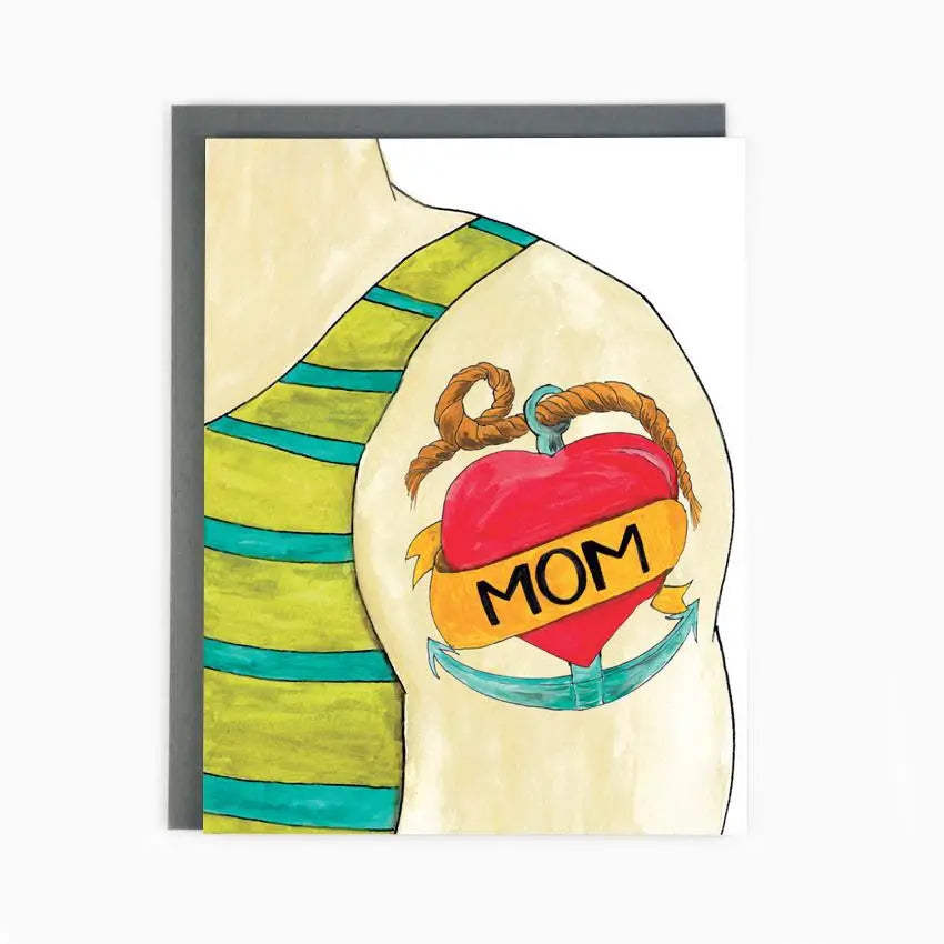 a greeting card with an illustration of a person's arm on it is a large red hearth tatoo that says mom. wearing a green and blue stipped tank top 