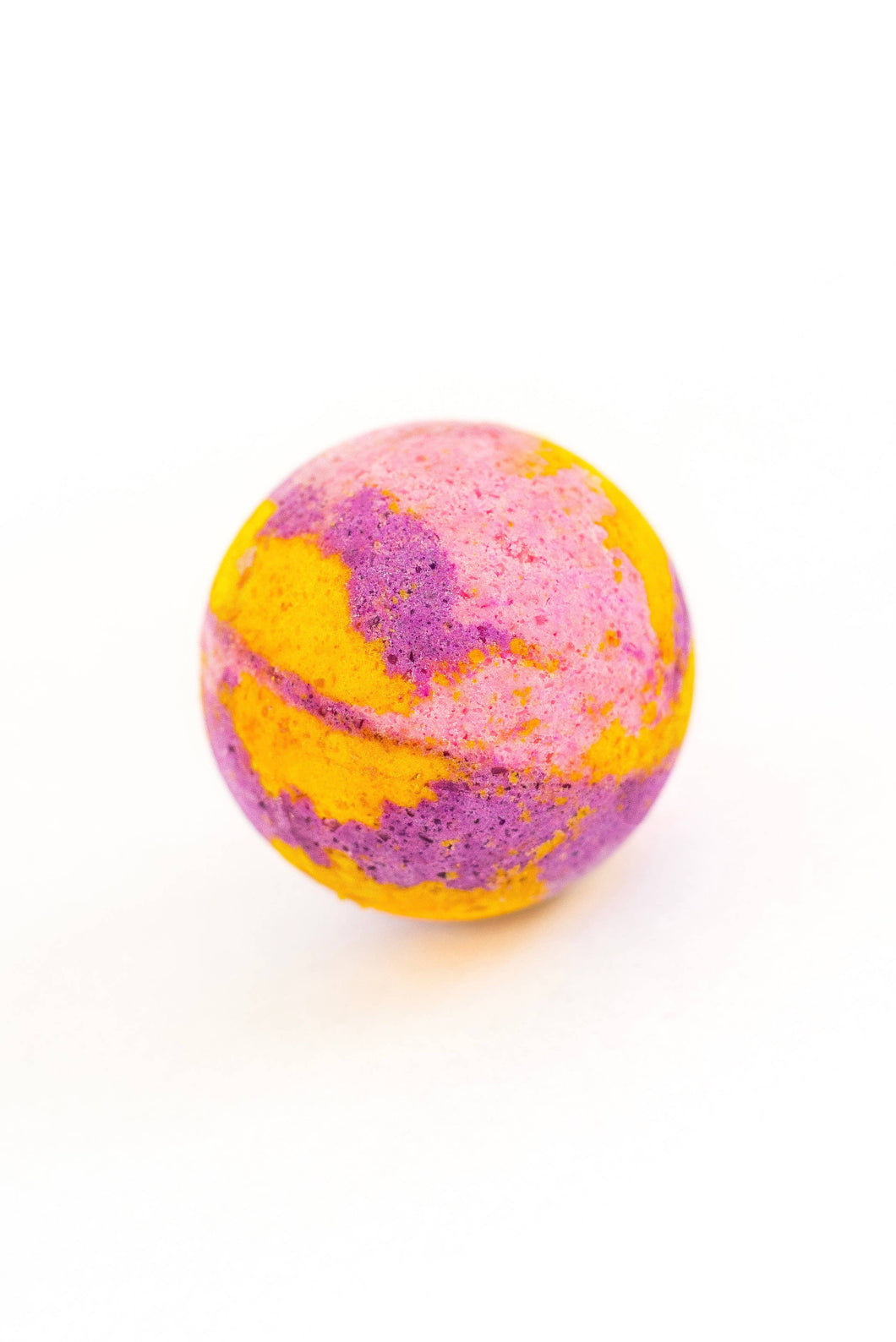 colourful pink purple and orange round bath bomb from soak bath co. 
