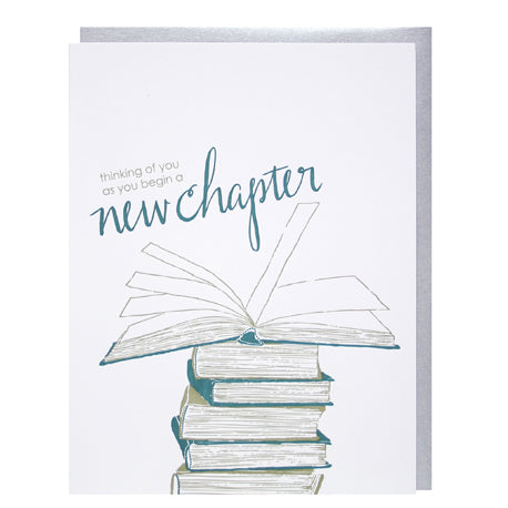 an illustration of a stack of books with the one on top open script says thinking of you as you begin a new chapter white background with teal coloured accents 
