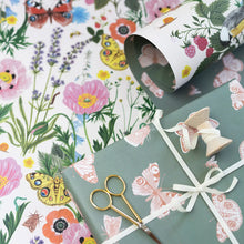 Load image into Gallery viewer, floral gift wrap with butterflies on a table with ribbon and scissors 
