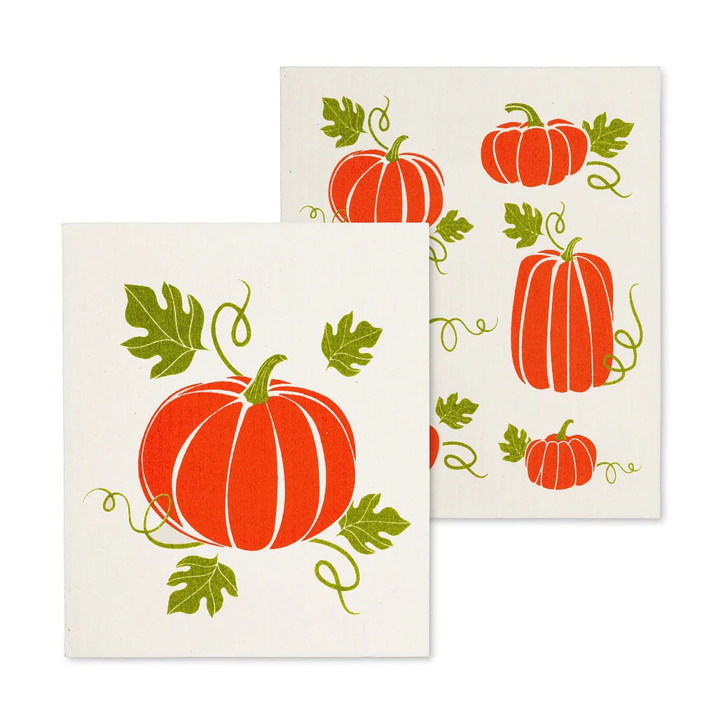 tow rectangle shaped swedish dishcloths with pumpkin drawing on each. orange colours on cream cloth with green leavess