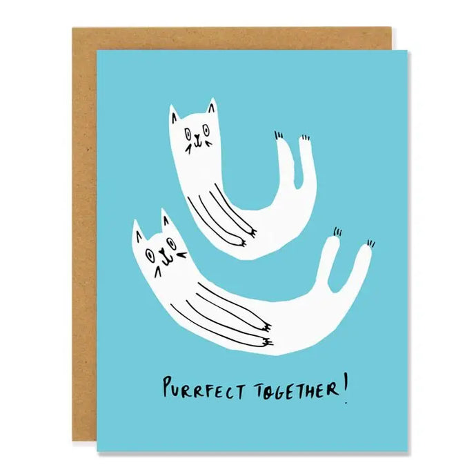 a greeting card in light blue colour with two curled up white cats text purrfect together 
