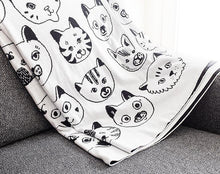 画像をギャラリービューアに読み込む, a blanket throw white side with black kittie faces motif 
