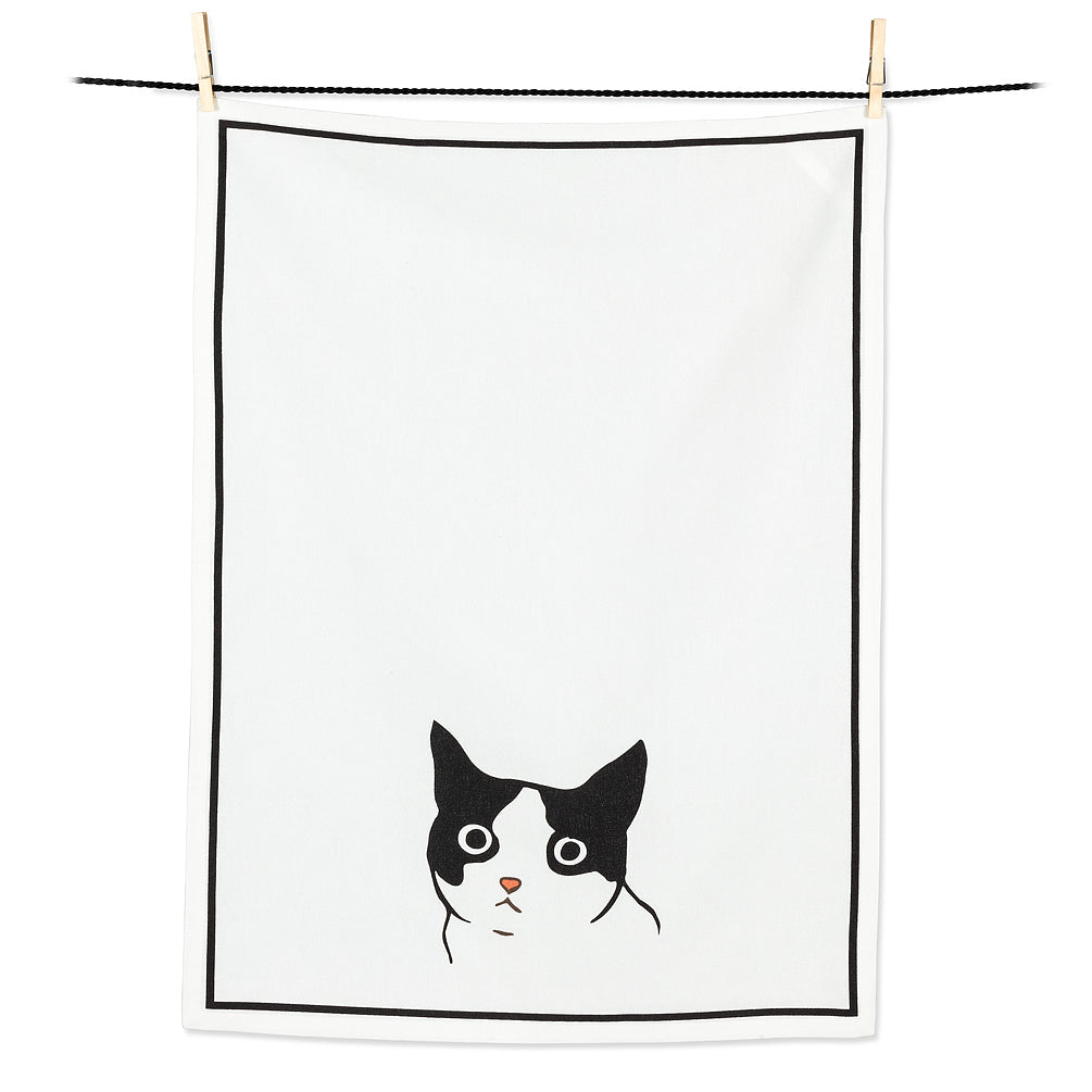 a white tea towel with a black and white cats head on the motif 