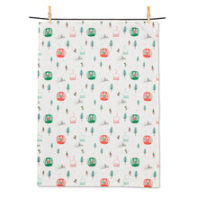 Load image into Gallery viewer, a white tea towel with red and green ski gondolas and small evergreen trees and skiers 
