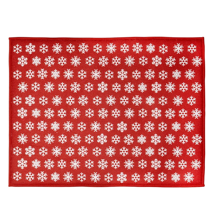 a kitchen drying mat in red colour with white snowflake motif 