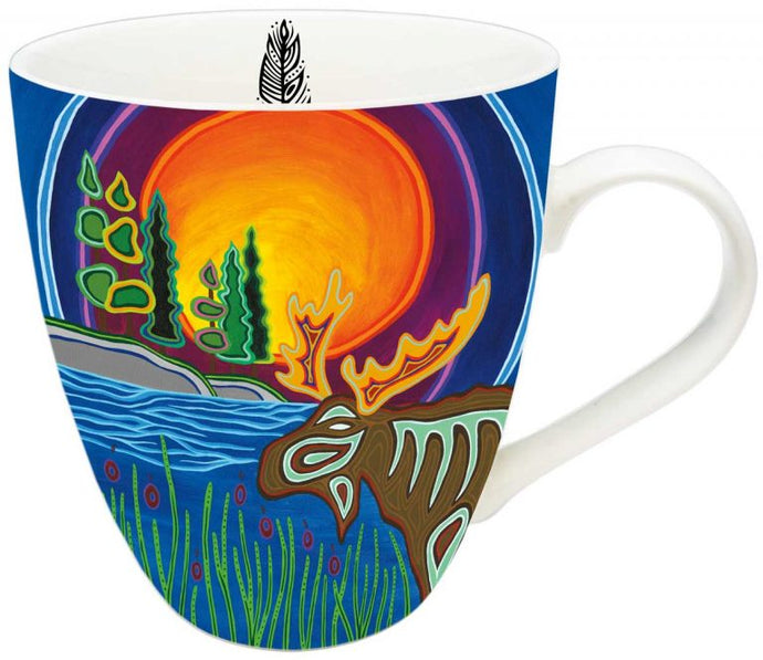 a coffee mug with imagae of a moose and sunset in Indigenous art design 