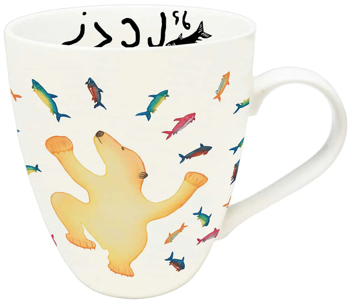 a mug with a polar bear with arms and legs out reached with various Arctic char and fish on the mug 