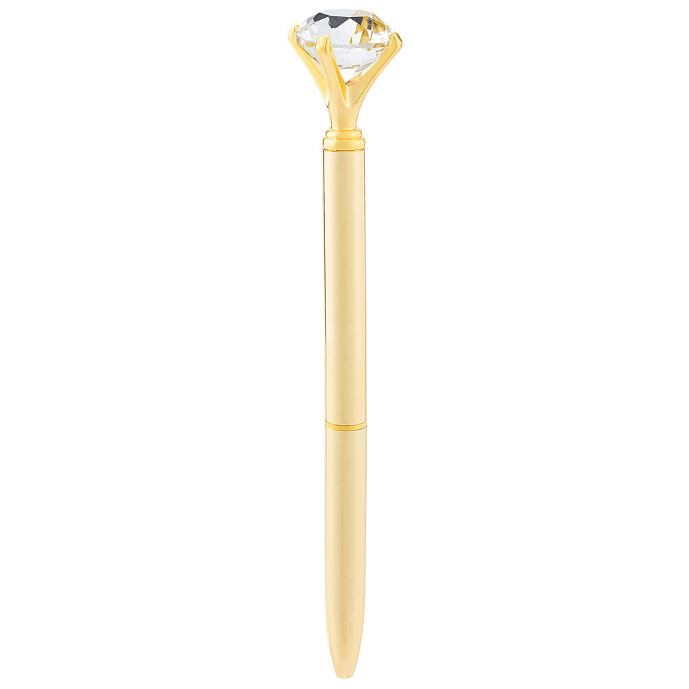 a gold pen with a large gem like a diamond on the top