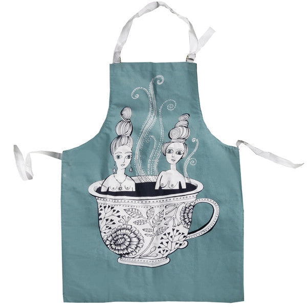 an apron with two ladies sitting in a hot cup of tea. whimsical 