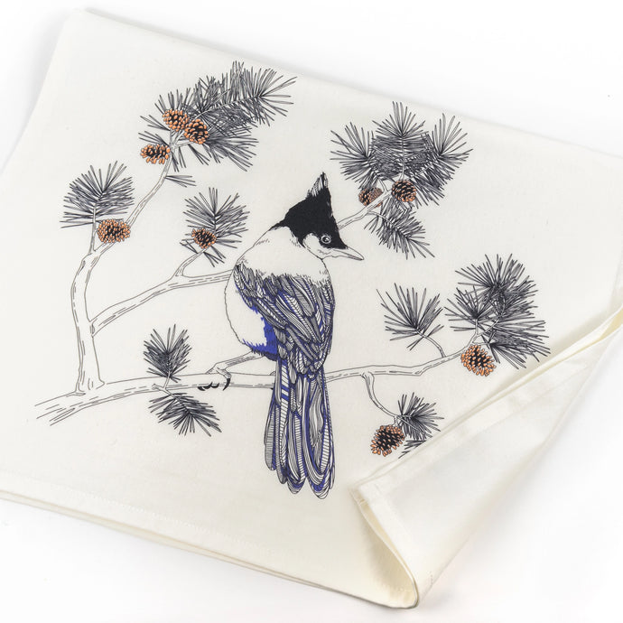 a white tea towel with a steller jay bird sitting on a branch