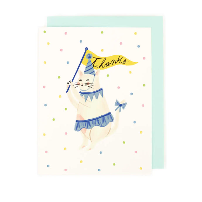 greeting card with an illustration of a cat wearing a little skirt and aparty hat. with bow on its tail. text thanks on a banner it is holding like a falg