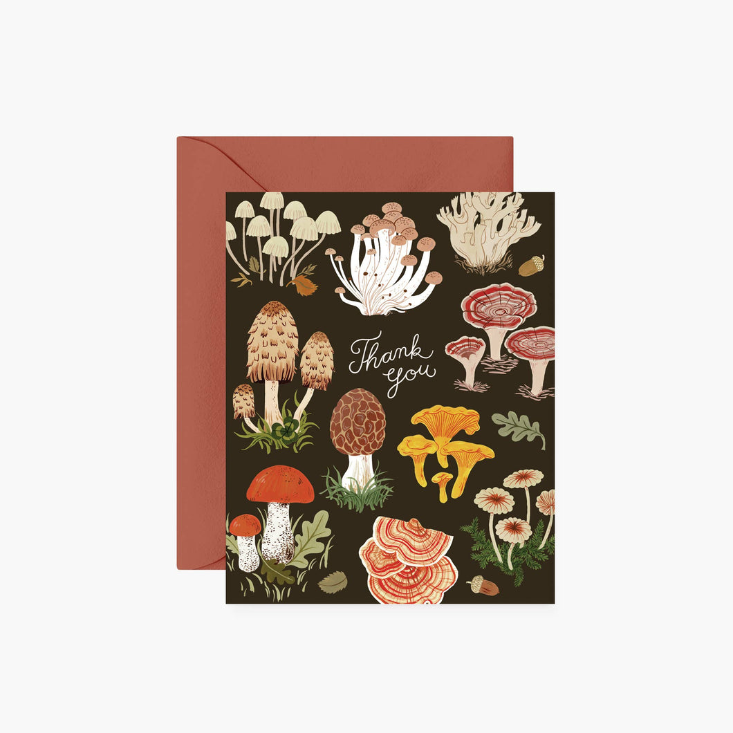 a greeting card covered in various mushroom illustrations on black background 