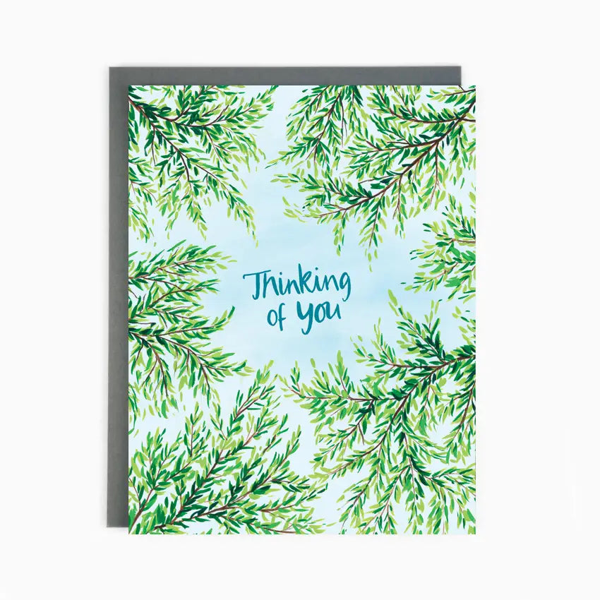  colour illustration of green branches from a tree in the sky with text thinking of you 
