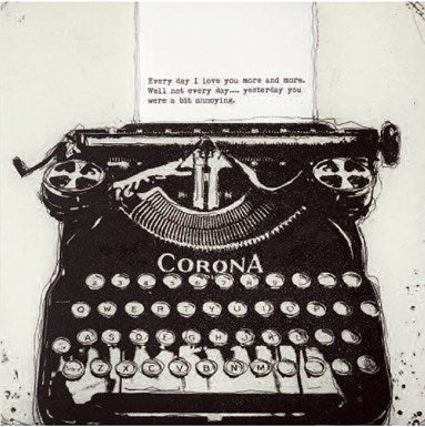 black vintage typewriter on white backdrop