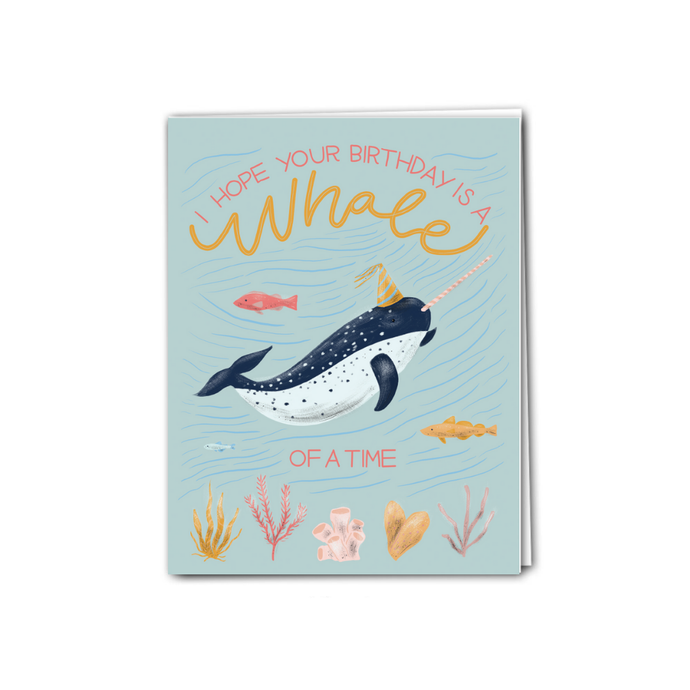 an illustration of a blue whale with a party hat and little fish and coral blue backdrop