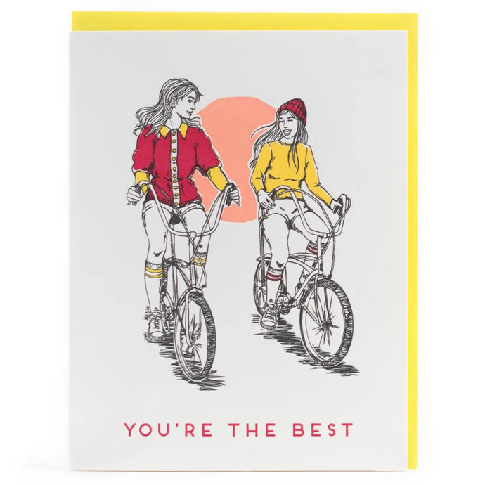 a letterpress greeting card depicting two girls riding their vintage banana bikes text you're the best 