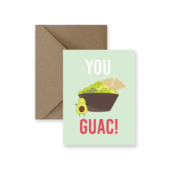 photo of a greeting card with a bowl of guacamole dip and a little avocado . text you guac
