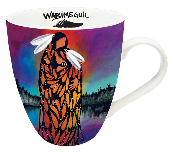 a coffe mug with Indigenous art depicting two people embracing 
